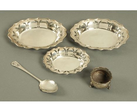 Three pierced silver dishes, two Sheffield 1960, one 1962, pair width 15 cm, a silver salt and silver preserve spoon, Sheffie