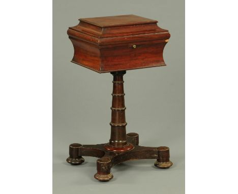 A William IV mahogany teapoy, with caddy top to fitted interior and raised on a quatreform base.