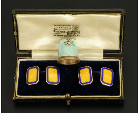 A pair of silver and enamel cufflinks, cased, and an enamelled thimble. CONDITION REPORT: The surfaces of the cufflinks are i