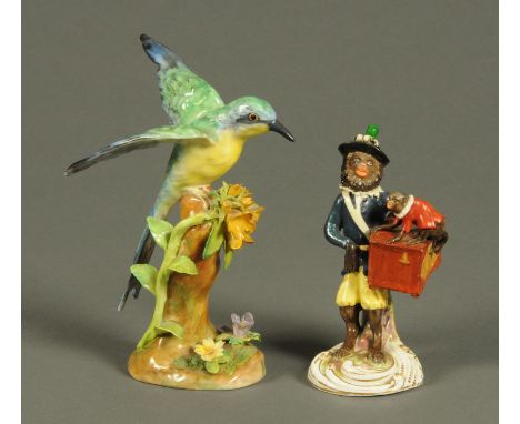 A late 19th century German porcelain figure of an organ grinder, and a Crown Staffordshire figure of a bee eater signed J.T. 