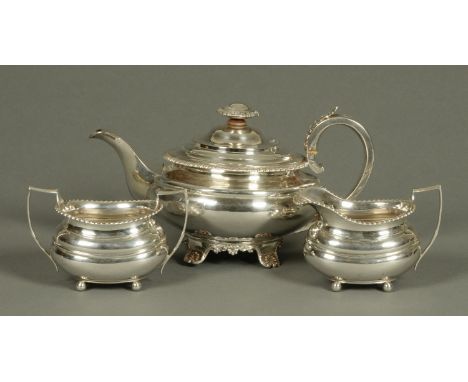 A three piece silver tea service, matched, the teapot London 1828, sugar basin and milk jug 1938, 1087 grams (see illustratio