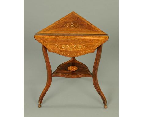 An Edwardian inlaid rosewood triangular occasional table, with three serpentine flaps, shaped legs and shelf.  Width 59 cm. 