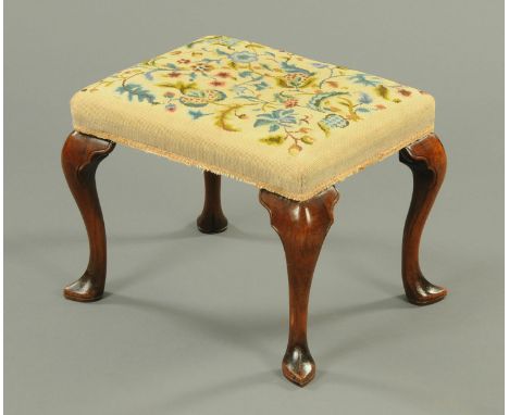 A 19th century walnut dressing stool, in the Queen Anne style, the top upholstered in woolwork tapestry and raised on four ca