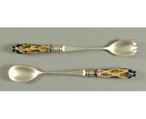 A pair of silver plated salad servers, with Doulton handles, circa 1900.  Length 30 cm.  CONDITION REPORT: This salad servers