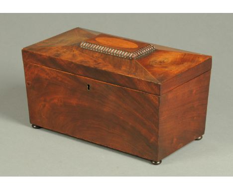 A Regency mahogany sarcophagus shaped tea caddy, with centre aperture and two lidded caddies.  Width 29 cm. 