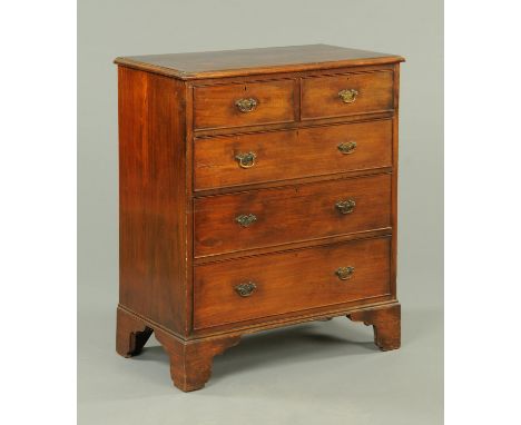 A late 19th century mahogany chest of drawers, with two short and three long graduated drawers with brass drop handles with s