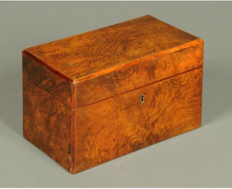 An early 19th century walnut tea caddy, with two interior dome topped compartments.  Length 25 cm.  CONDITION REPORT: This ca
