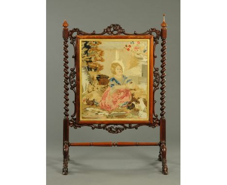 A large Victorian rosewood framed fire screen, with tapestry of young girl in landscape, with barley sugar twist turned suppo