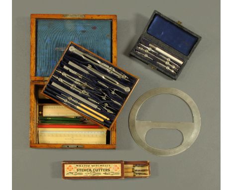 An oak cased set of drawing instruments, some marked "Reynolds", and with series of ivory rules, with Chadburn Brothers protr