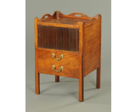 A George III mahogany bedside cabinet, converted from a commode, with tray type top, tambour front and false drawer and raise