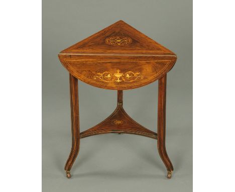 An Edwardian inlaid rosewood triangular occasional table, with three drop flaps and raised on legs of square section united b