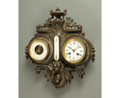 A 19th century French combined clock barometer and thermometer, housed in a cast iron frame.