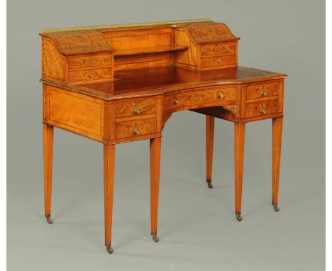 A George III style satinwood Carlton House type desk, with brass Gallery to the rear superstructure fitted with a series of f