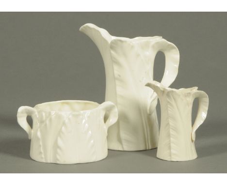 A Royal Worcester milk jug, cream jug and sugar basin.  Tallest 14.5 cm. 