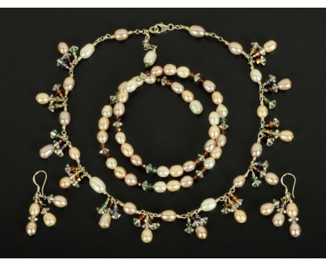 A silver freshwater pearl and Swarovski crystal suite of jewellery, necklace, bangle and pair of earrings.  