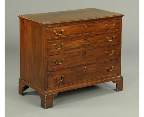A George III mahogany chest of drawers, with moulded edge above four long graduated drawers with brass drop handles and cockb