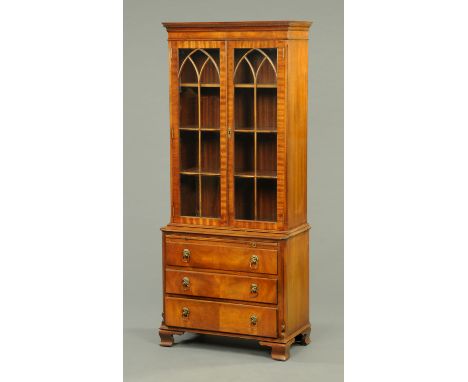 A Bevan Funnel mahogany glazed cabinet on chest, with dentil cornice above a pair of glazed doors with wooden astragals enclo