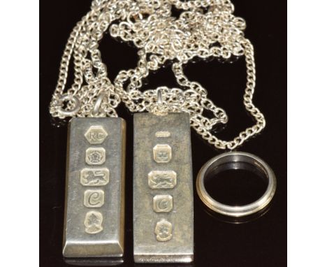 Two silver ingot pendants on chains and a silver ring, 75g&nbsp;