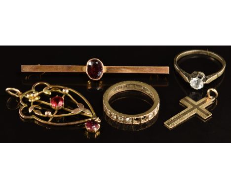 A 9ct gold bar brooch set with a garnet, Edwardian&nbsp;pendant set with garnets, 9ct gold cross, 9ct gold eternity ring (8.8