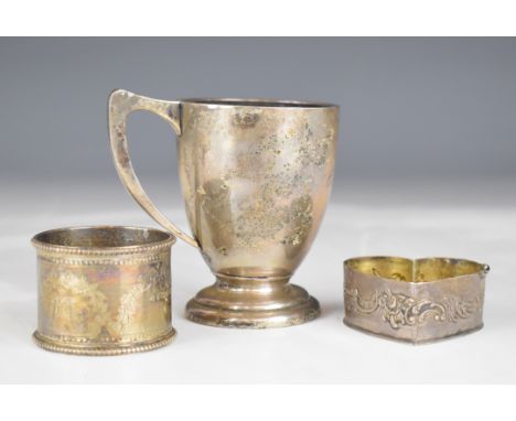 Hallmarked silver christening mug, hallmarked silver napkin ring and a heart shaped trinket box base, likely continental, wei