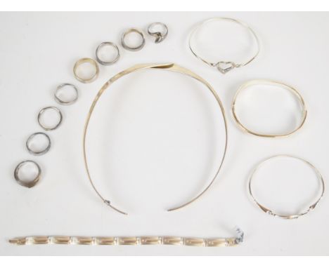 Eight silver rings including six set with diamonds, three silver bangles including two set with diamonds, a silver bracelet s