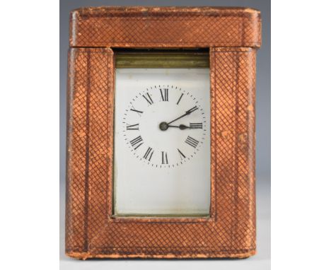 Late 19th or early 20th century brass cased carriage clock with bevelled glass and white enamel dial with Roman numerals, in 