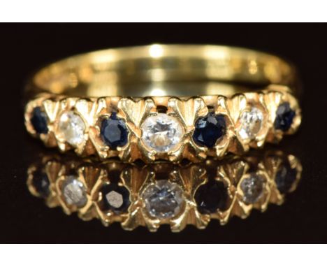 An 18ct gold ring set with diamonds and sapphires, 2.7g, size N
