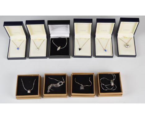 Four silver pendants set with diamonds, five silver pendants set with enamel and diamonds and a silver pendant set with topaz