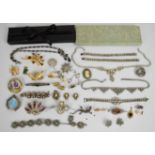 Diamanté necklaces and bracelets, two silver rings, Art Deco brooches, silver compact set with