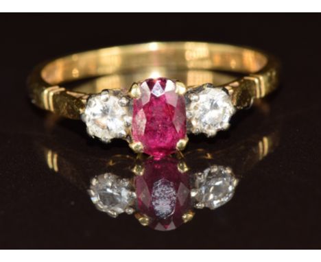 An 18ct gold ring set with a ruby and diamonds, 3.3g, size Q