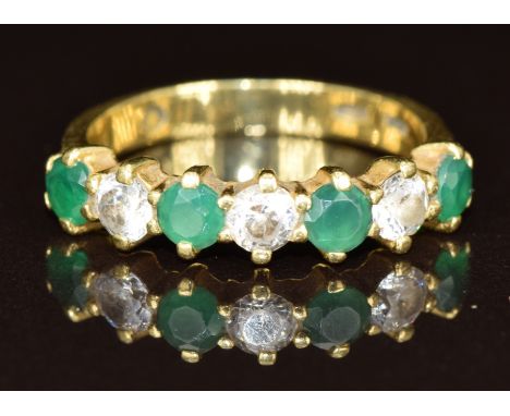 An 18ct gold ring set with cubic zirconia and synthetic green stones, 3.3g, size L