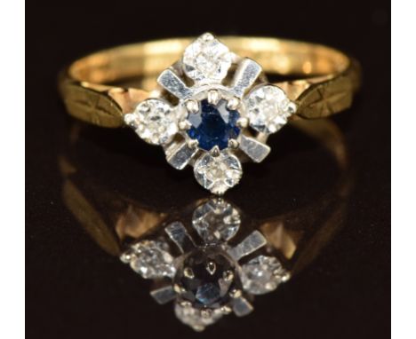 An 18ct gold ring set with a sapphire and diamonds, 2.4g, size L
