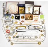 A collection of jewellery including Swarovski brooch, French jet necklace, Kirks Folly charm