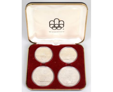 Set of four 1976 Montreal Olympics commemorative silver coins comprising two each of $10 and $5 coins, weight of all four coi