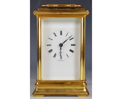 St. James, London gilt metal cased carriage clock with bevelled glass and white enamel dial marked made in England, height in