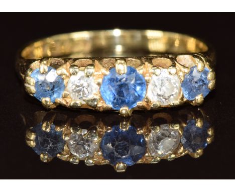 An 18ct gold ring set with sapphires and diamonds, 2.4g, size J