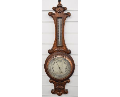 Elkington Art nouveau oak cased aneroid barometer and thermometer with silvered dial and scale and bronzed hands and bezel, o