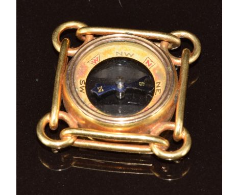 An 18ct gold compass charm, 7.1g, 1.8cm