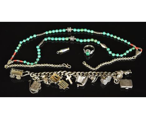 A silver charm bracelet with ten charms (88g), Navajo silver necklace set with turquoise and coral, Egyptian charm opening to