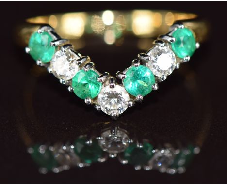 An 18k gold 'V' shaped ring set with alternating diamonds and emeralds, each approximately 0.15ct, 3.9g, size T