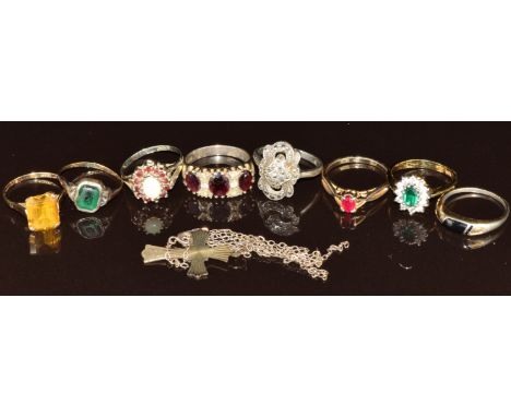 A 9ct gold ring set with an emerald cut synthetic yellow sapphire (2.7g, size P), three silver rings, a 9ct gold and silver r