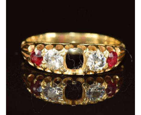 An 18ct gold ring set with rubies and diamonds, each diamond approximately 0.15ct (centre ruby missing), 2.6g, size L