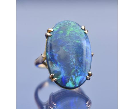 A c1910 9ct gold ring set with a black opal measuring 16.4 x 24.4 x 4.1mm, 6g, size K