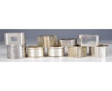 Nine various hallmarked silver napkin rings including engine turned examples and a triangular Art Deco style example, weight 