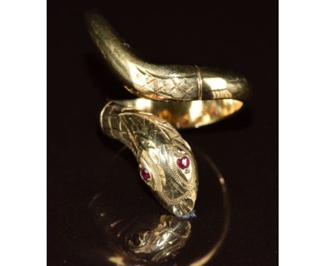 A 9ct gold serpent ring set with ruby eyes, 6.4g, size K