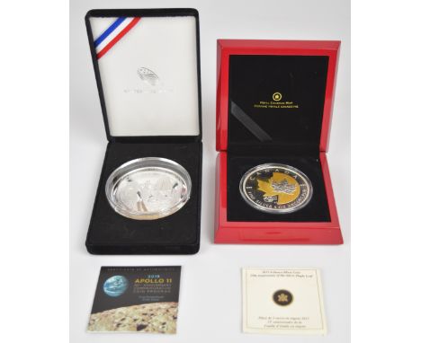 Two 5 oz silver coins comprising United States Mint 2109 Apollo 11 and Royal Canadian Mint 25th Anniversary of the silver Map