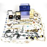 A collection of jewellery including silver rings, silver bangle, butterfly wing pendant, etc