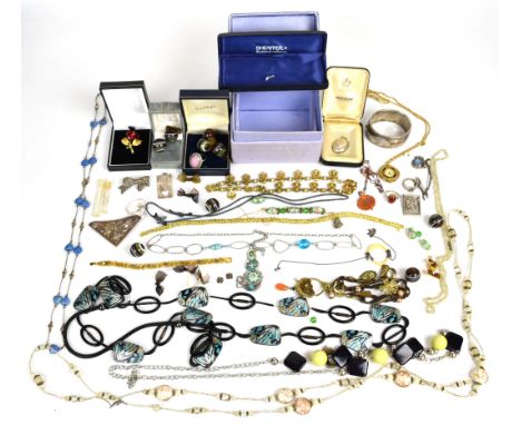 A collection of jewellery including silver rings, silver bangle, butterfly wing pendant, etc