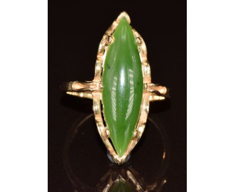 A 14k gold ring set with a marquise cut nephrite jade cabochon, 4.8g, size L