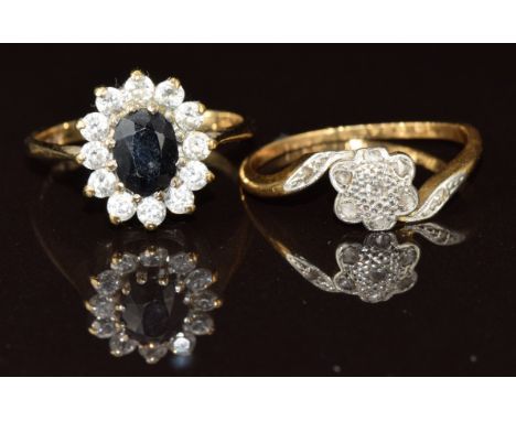 An 18ct gold ring set with diamonds in a floral platinum cluster (2g, size J) and a 9ct gold ring set with a sapphire surroun